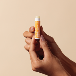 nu-skin-sunright-lipbalm-spf-15-with-vitamin-e-on-hand-image