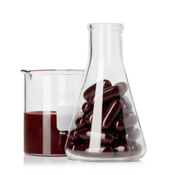 A flask filled with ageLOC Youth supplements placed next to a beaker of the ageLOC Youth blend.