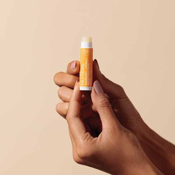 nu-skin-sunright-lipbalm-spf-15-with-vitamin-e-on-hand-image