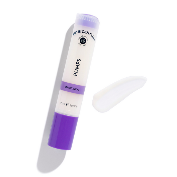 A Nutricentials Bakuchiol Pump lying next to a texture smear of serum on a white backdrop.