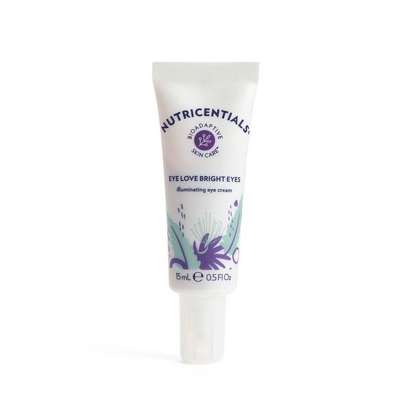 A tube of Nutricentials Illuminating Eye Cream placed in front of a white backdrop.