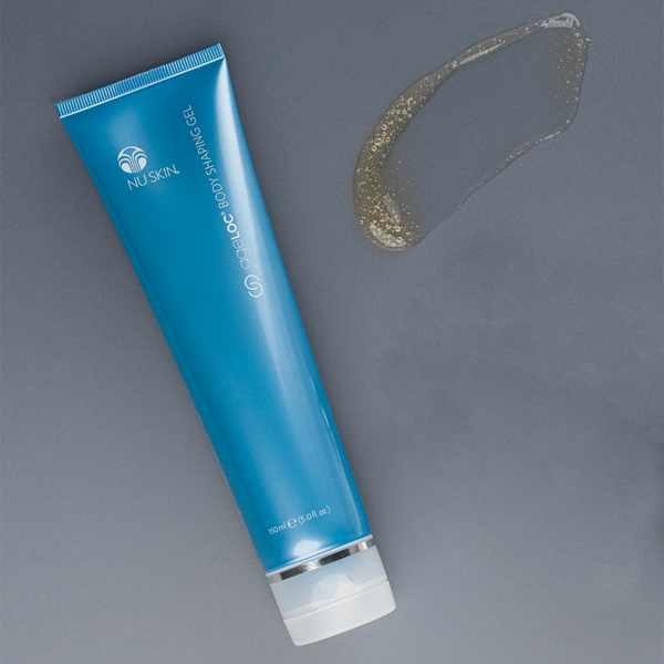 A tube of ageLOC Body Shaping Gel lying on a gray table next to a decorative smear of gel.