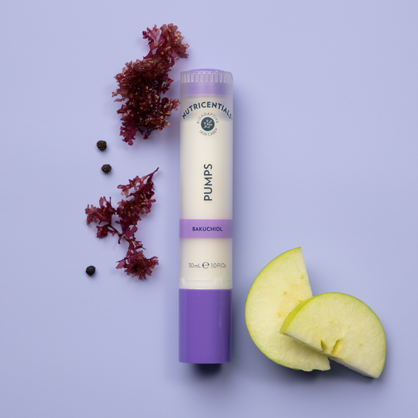 A Nutricentials Bakuchiol Pump lying next to a couple of apple slices and some Jania Rubens seaweed.